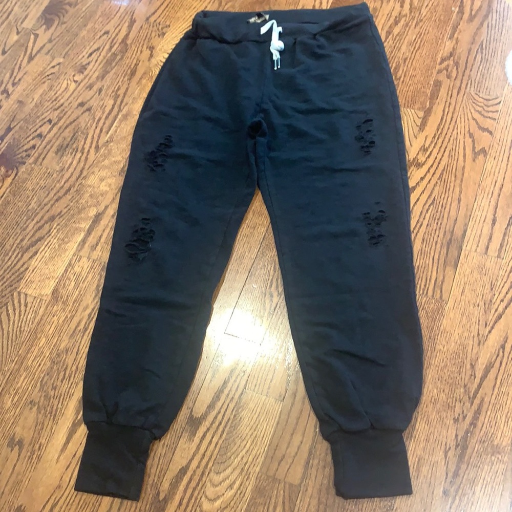 Oliviaceous Black ripped sweatpants.
